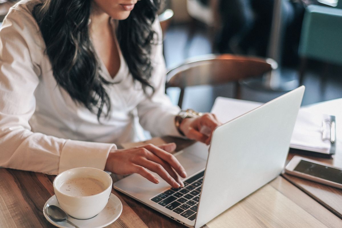 A woman typing on her laptop