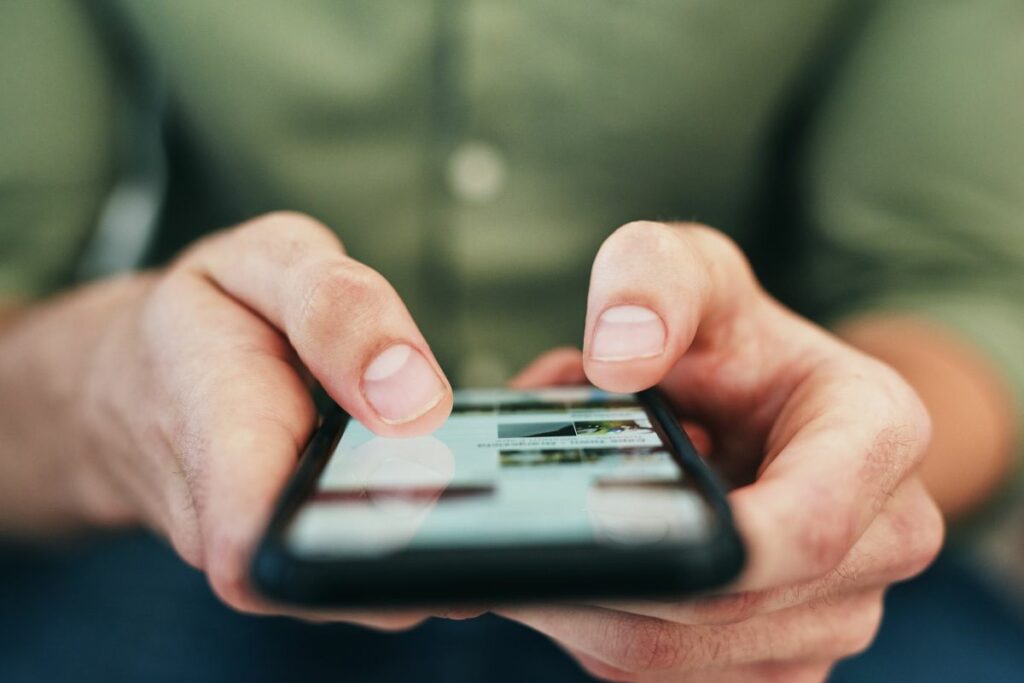 A person typing on their phone