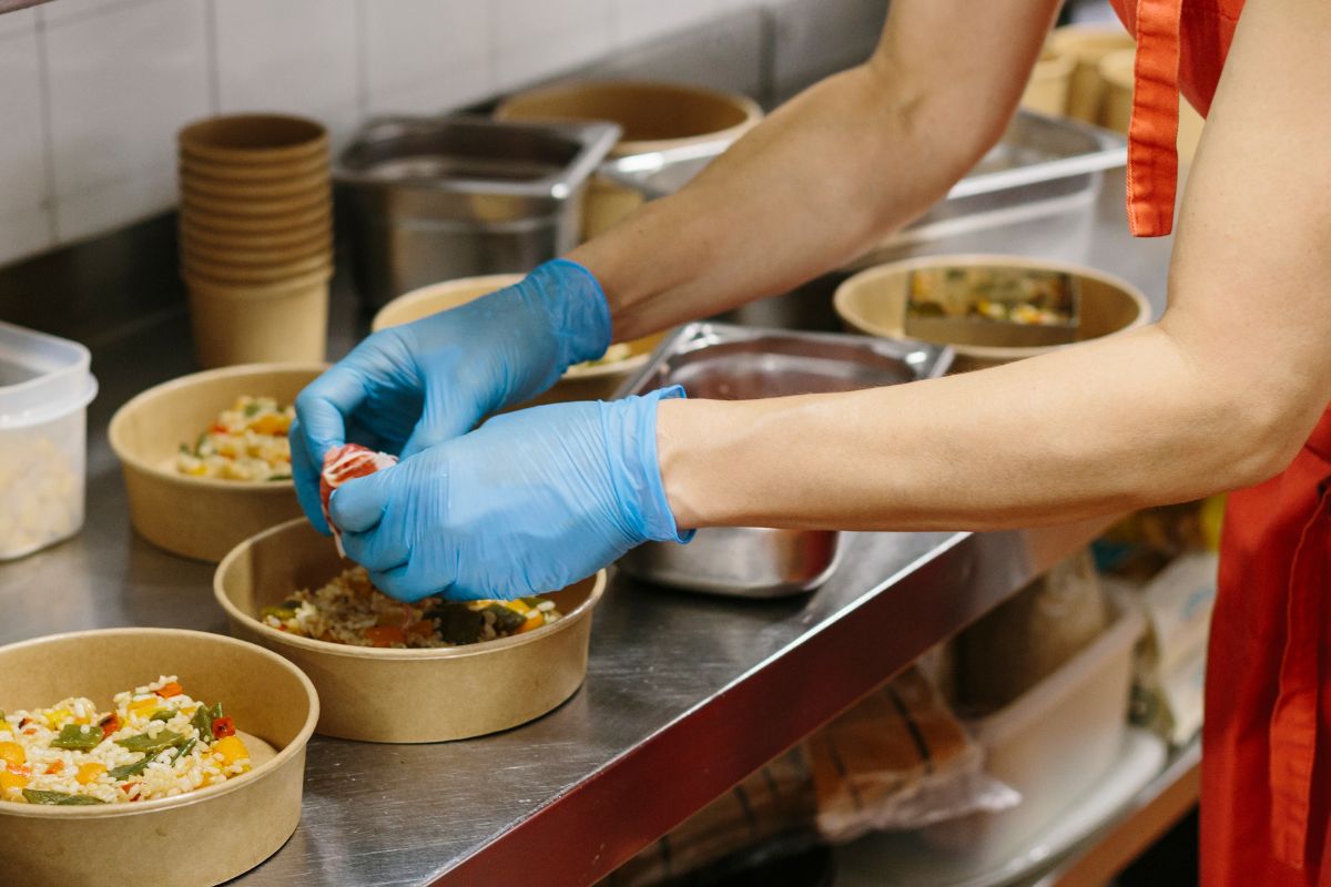 A F&B staff packing a takeaway order