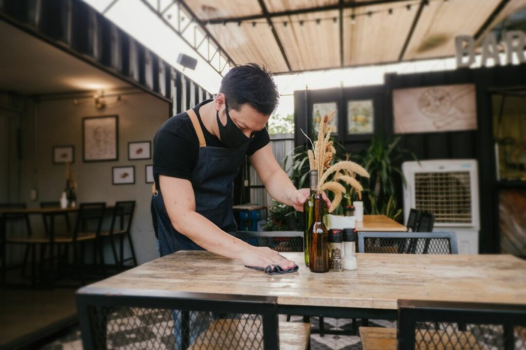 A Malaysian staff wiping the tables