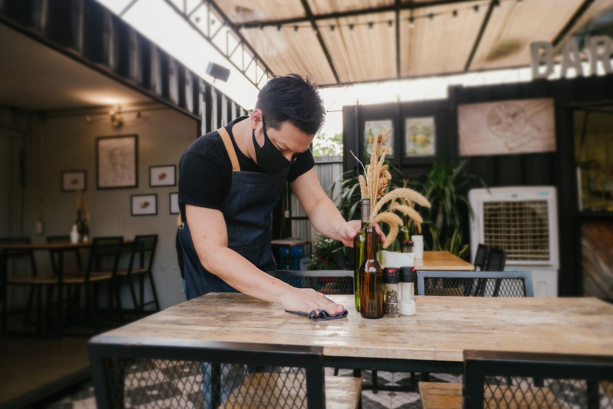 A Malaysian staff wiping the tables