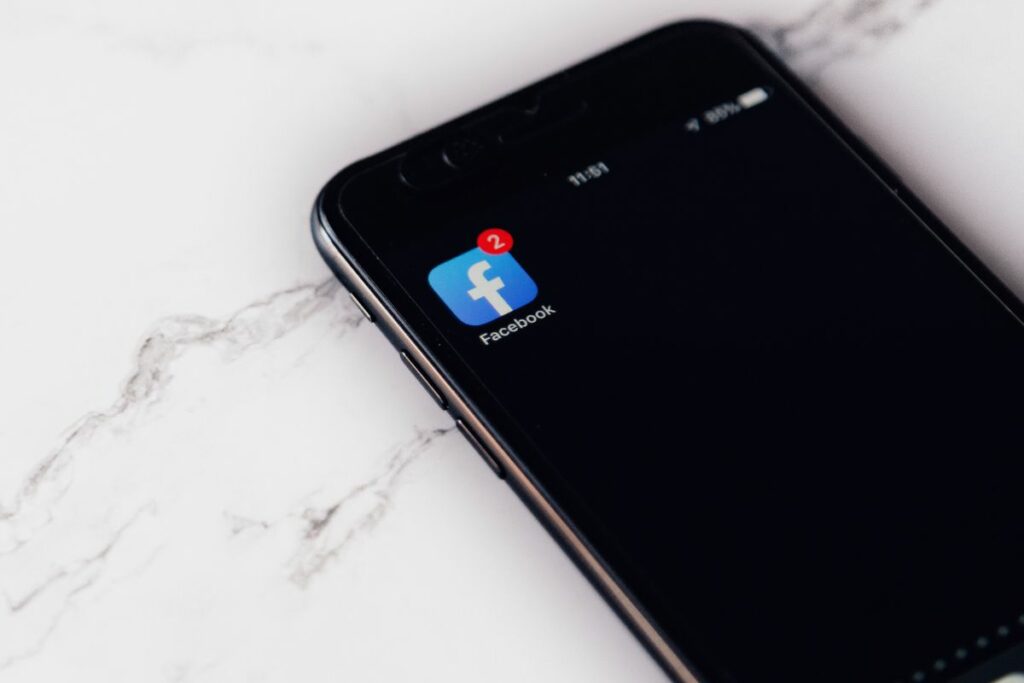 A phone with the Facebook app