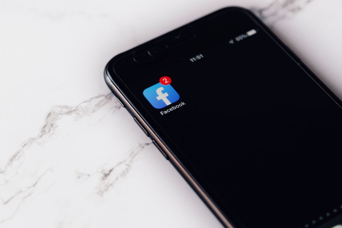 A phone with the Facebook app