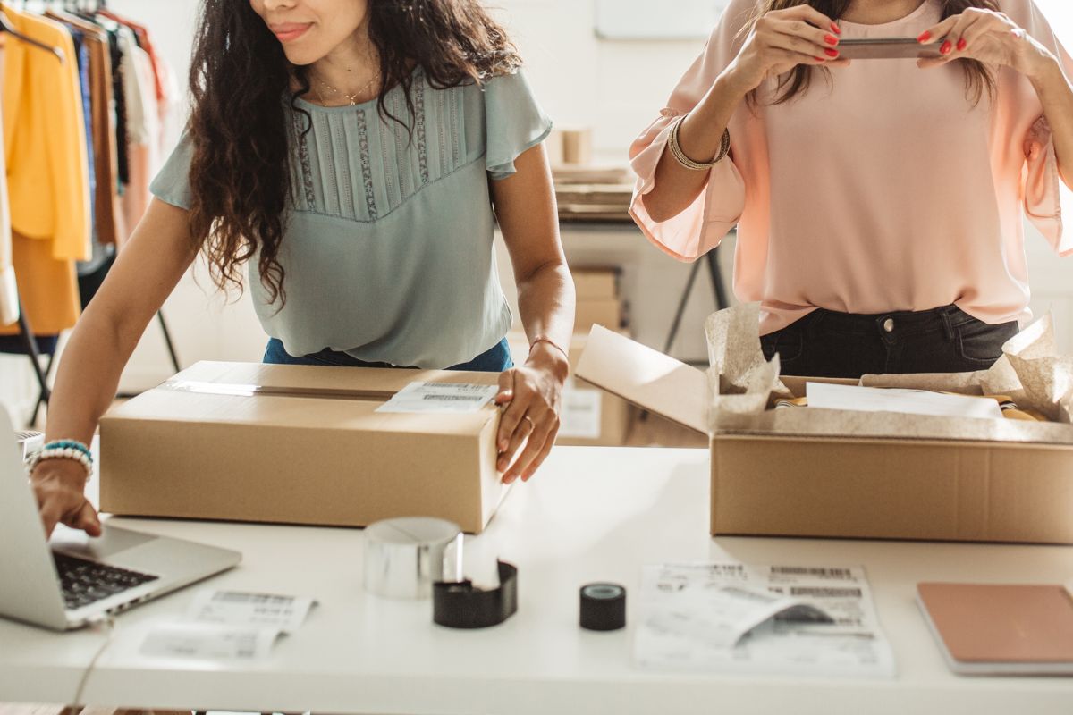 Two retail owners packing orders