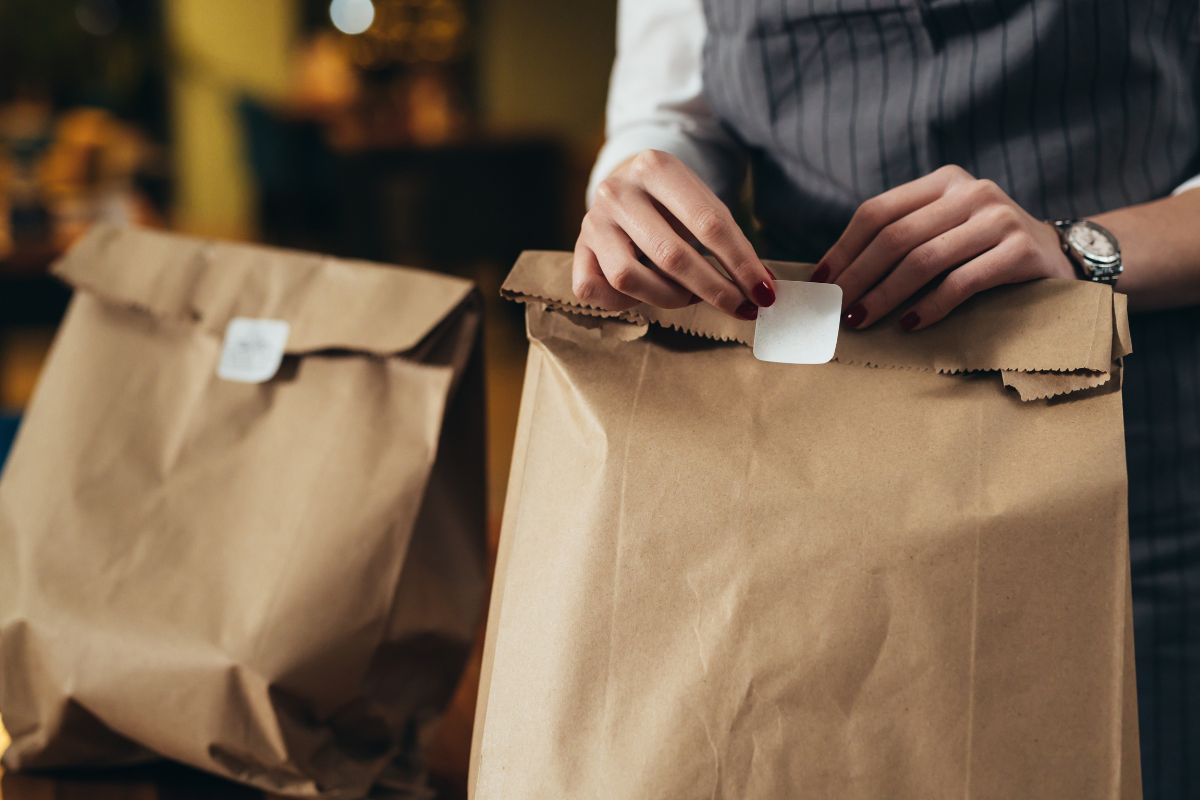 A Malaysian business owner packing food orders