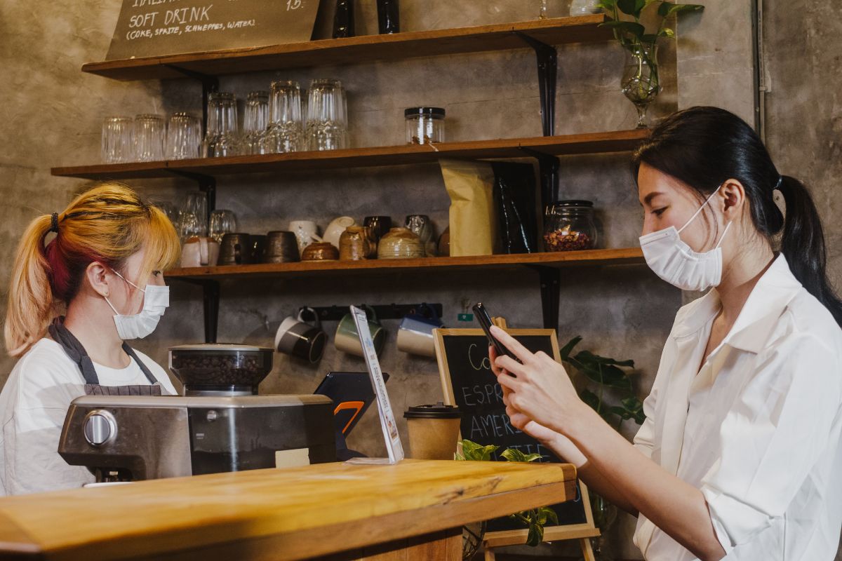 A customer and a cashier in a restaurant