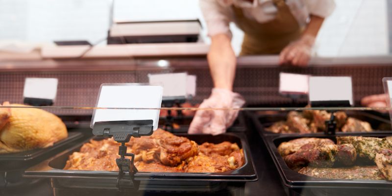 Food server placing items on display