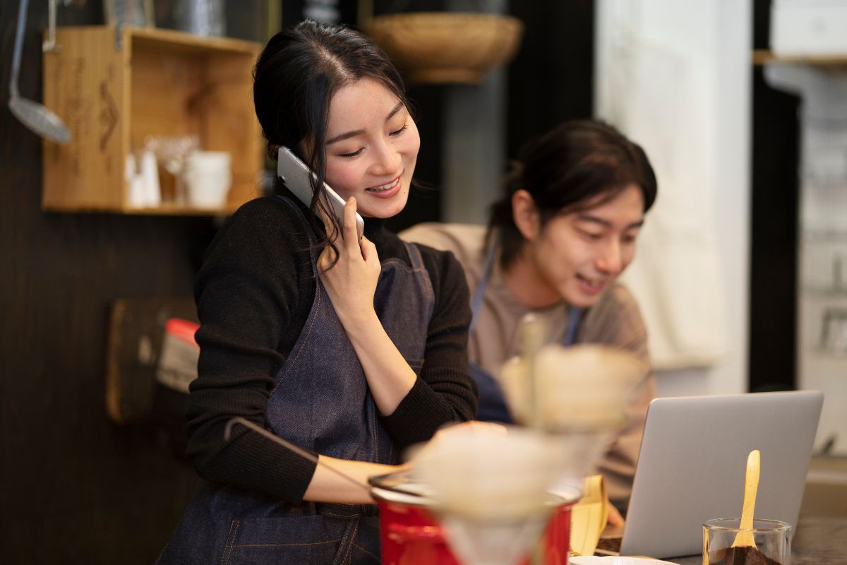 Restaurant owner picking up a call