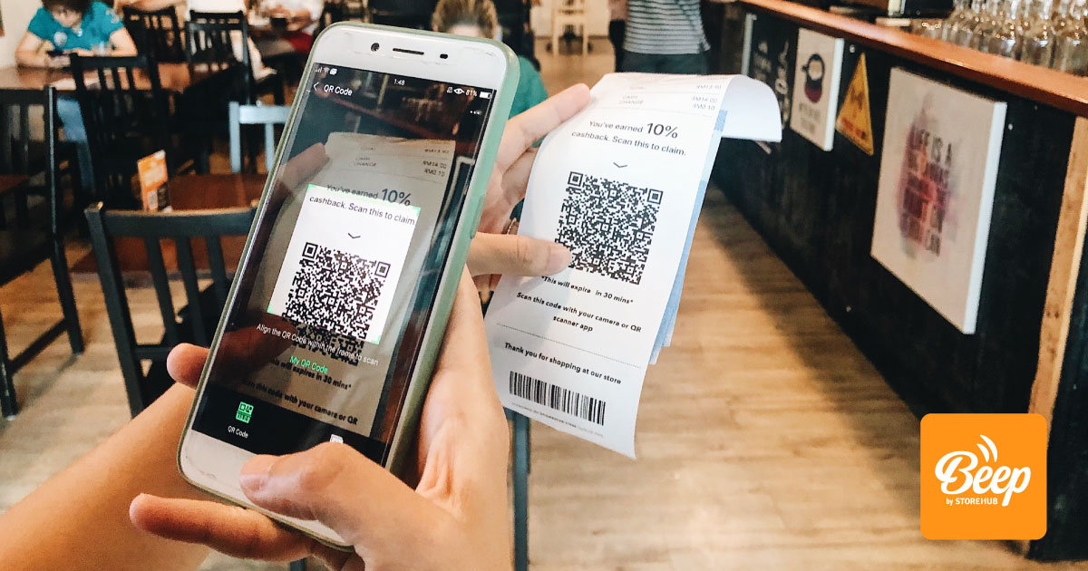 A customer scanning a QR Code on a receipt