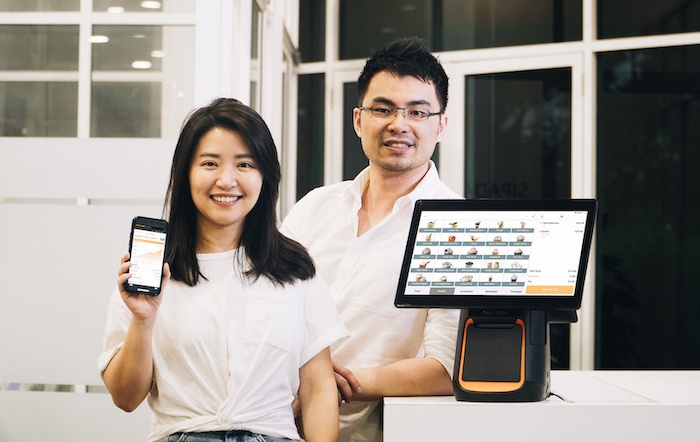 StoreHub cofounders Fong Wai Hong and Congyu Li with POS system