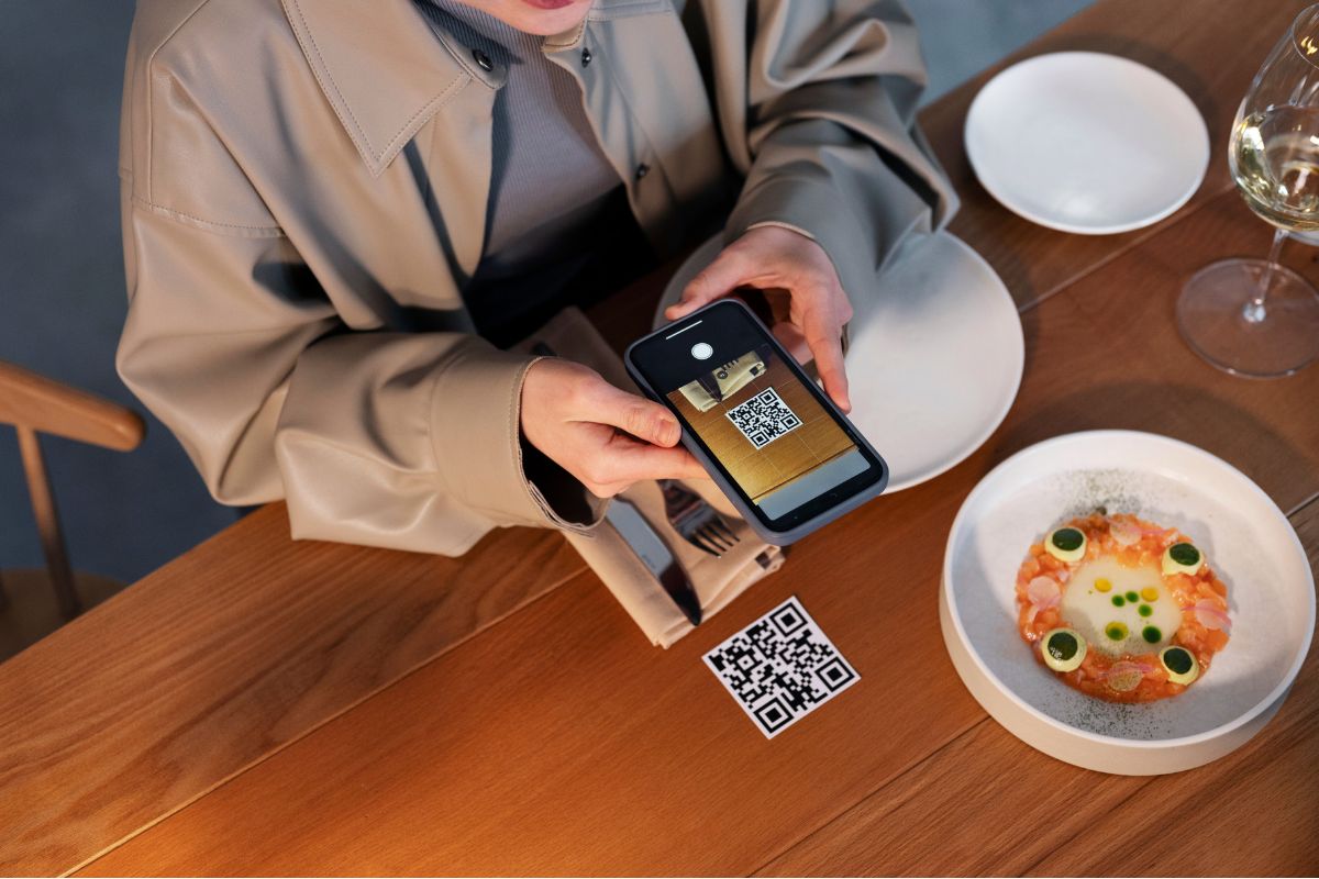 A customer scanning a QR code to restaurants online menu