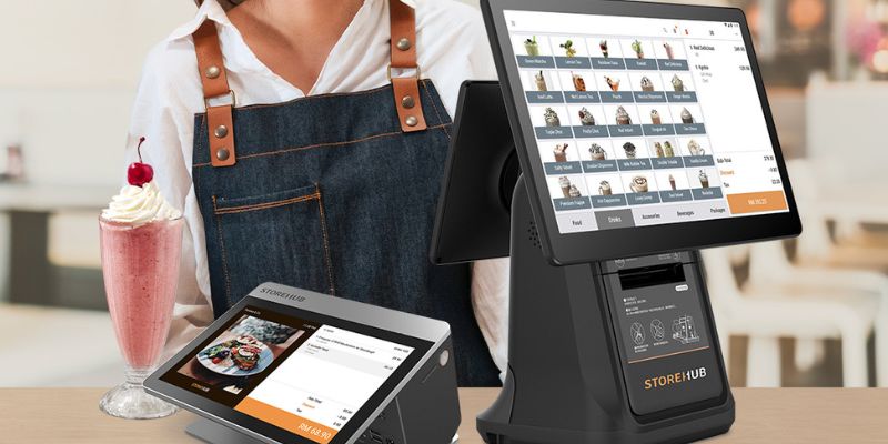 A restaurant owner happily uses her StoreHub POS system