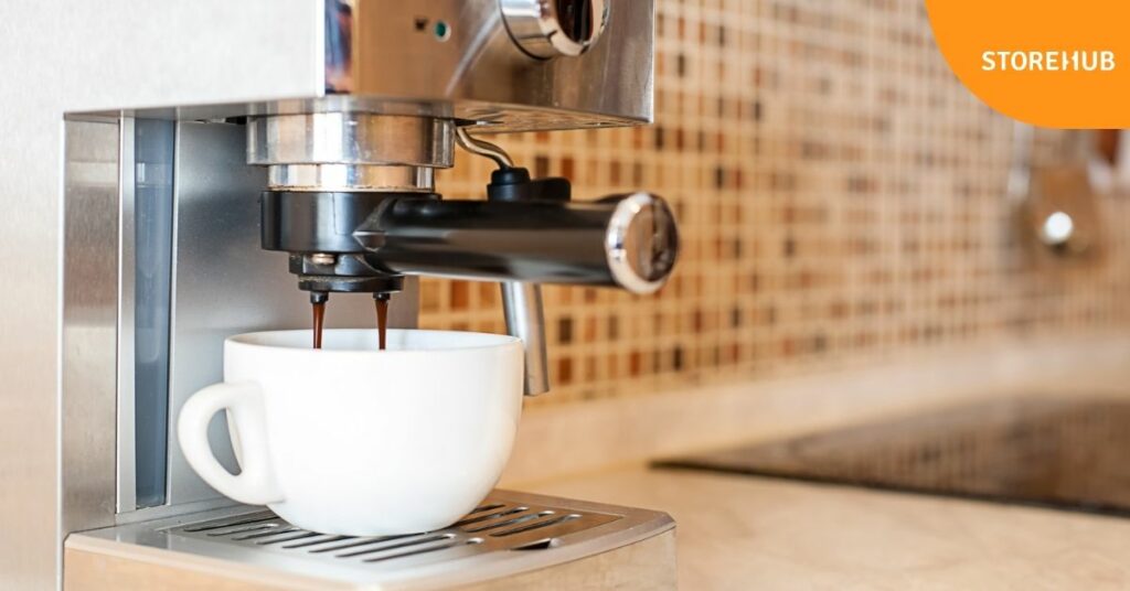 espresso maker with a cup of coffee