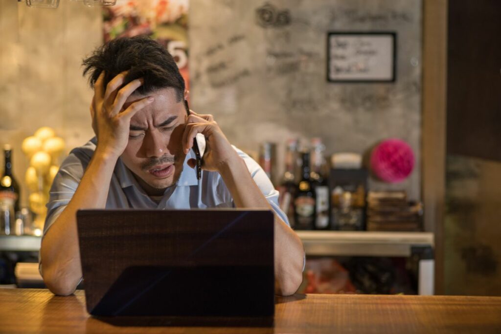 asian business owner stressed out