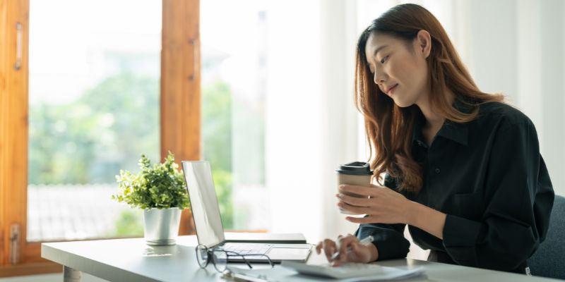 A business owner looking at her laptop