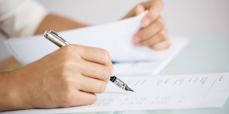 A person reviewing paperwork