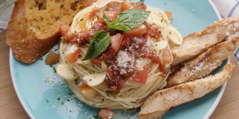 Angel Hair Pomodoro with grilled chicken, another popular dish served at TLC