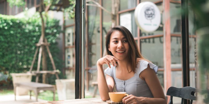 Customer enjoying their coffee in the cafe