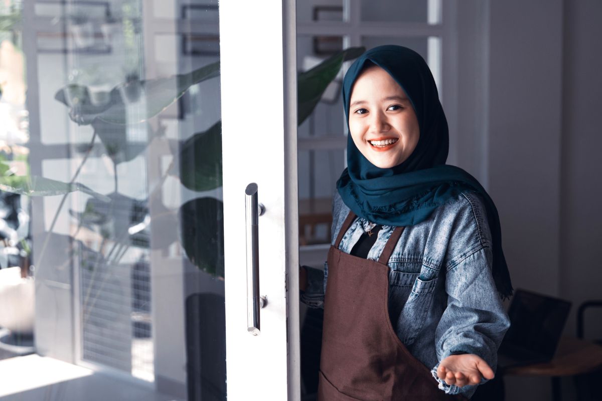 A Malaysian cafe owner opening her business for the day