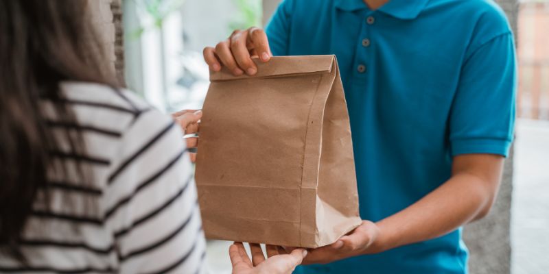 A delivery rider delivering food