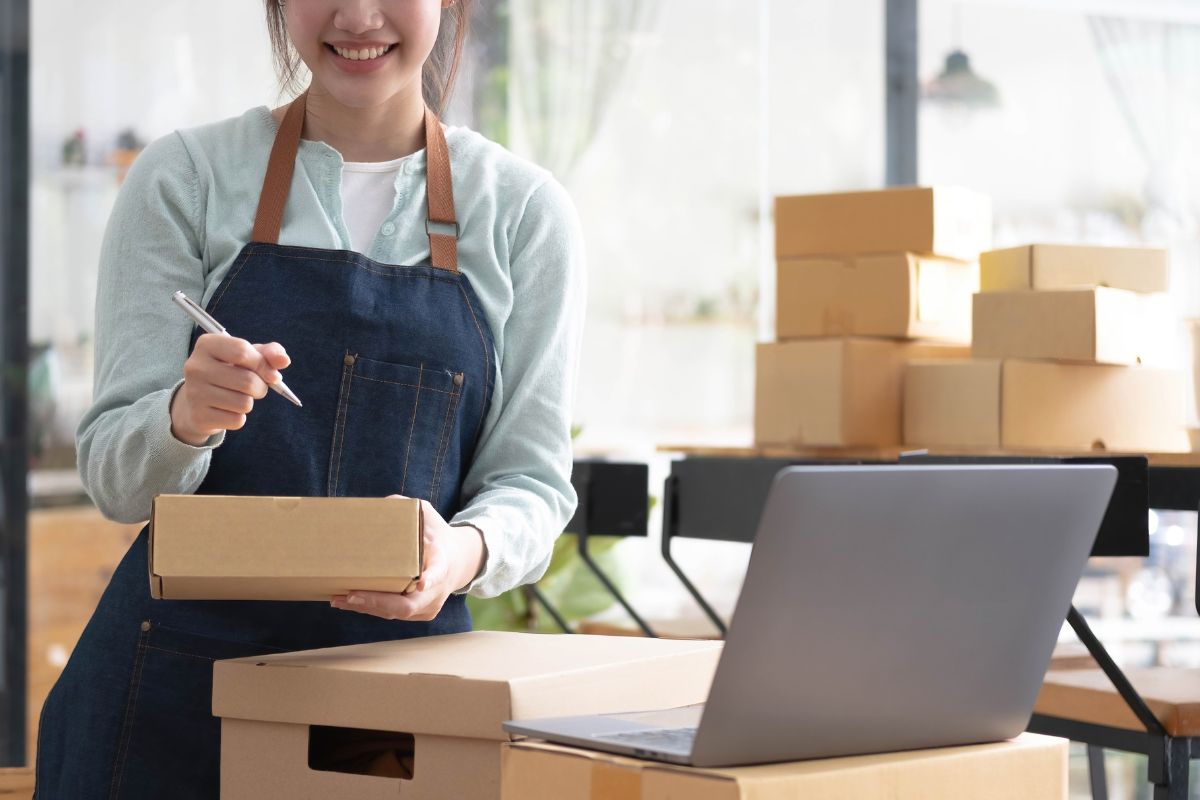 Business owner managing inventory and accounting for e-invoicing