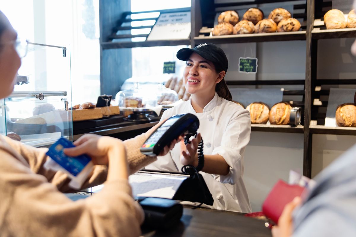 A Filipino business owner interacting with a customer