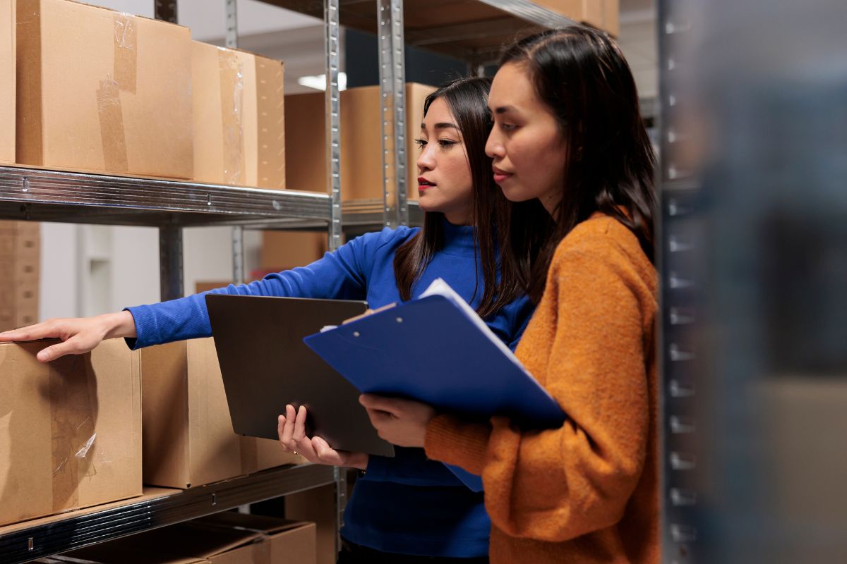 Two business owners managing their inventory