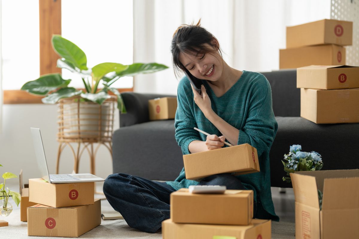 A Filipino business owner packing orders