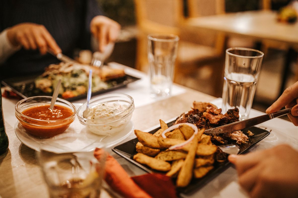 A couple eating food at a restaurant