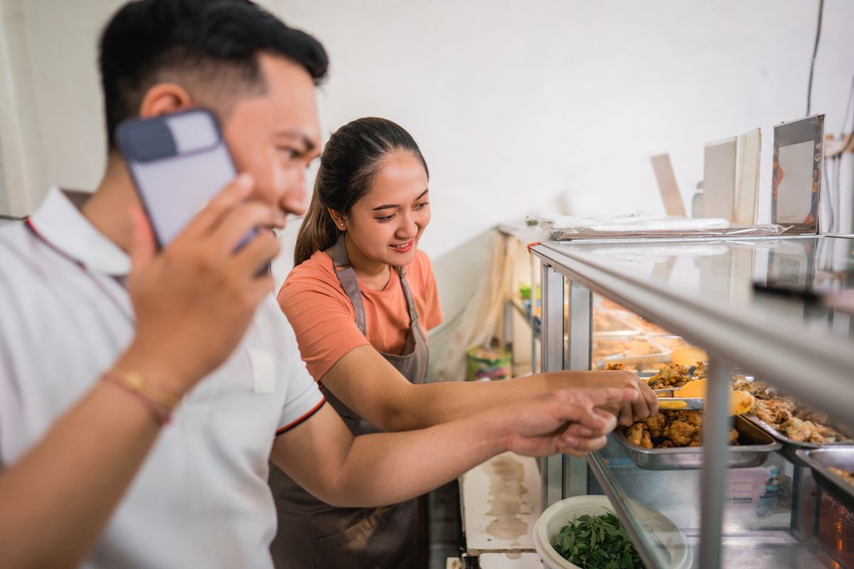 Two Filipino business owners in their restaurant