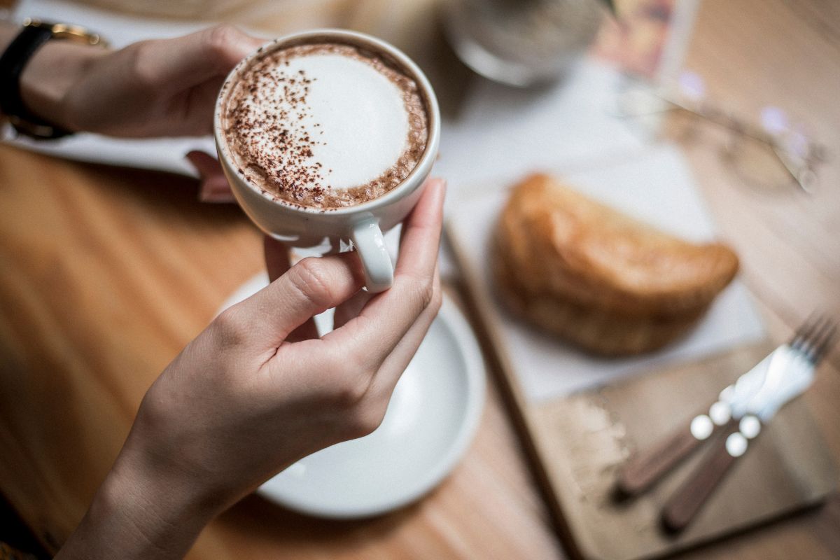A Filipino customer sipping his coffee at a cafe