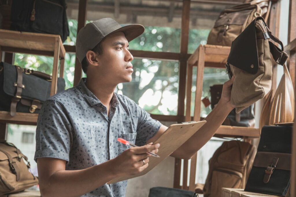 A Filipino retail business owner checking his products