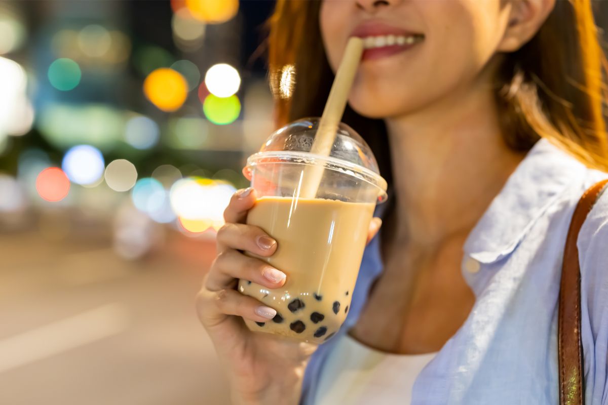 A woman enjoying bubble tea