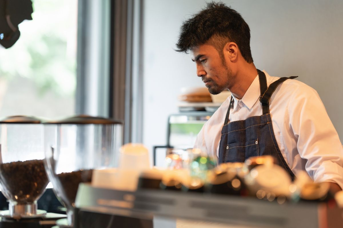 A Filipino business owner in his restaurant/cafe