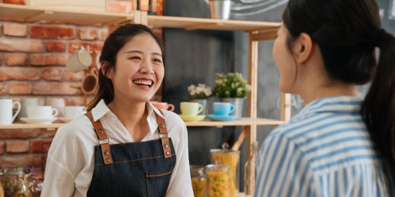 A F&B staff talking to a customer