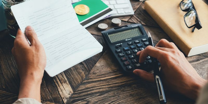 A person using a calculator