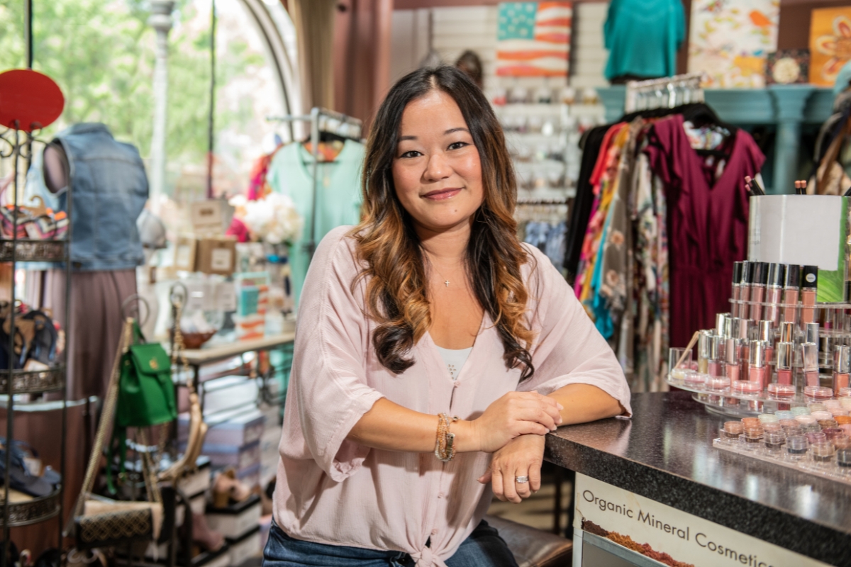An Asian business owner in her retail store