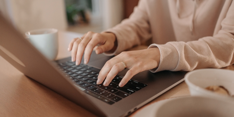 Business owner typing on a laptop