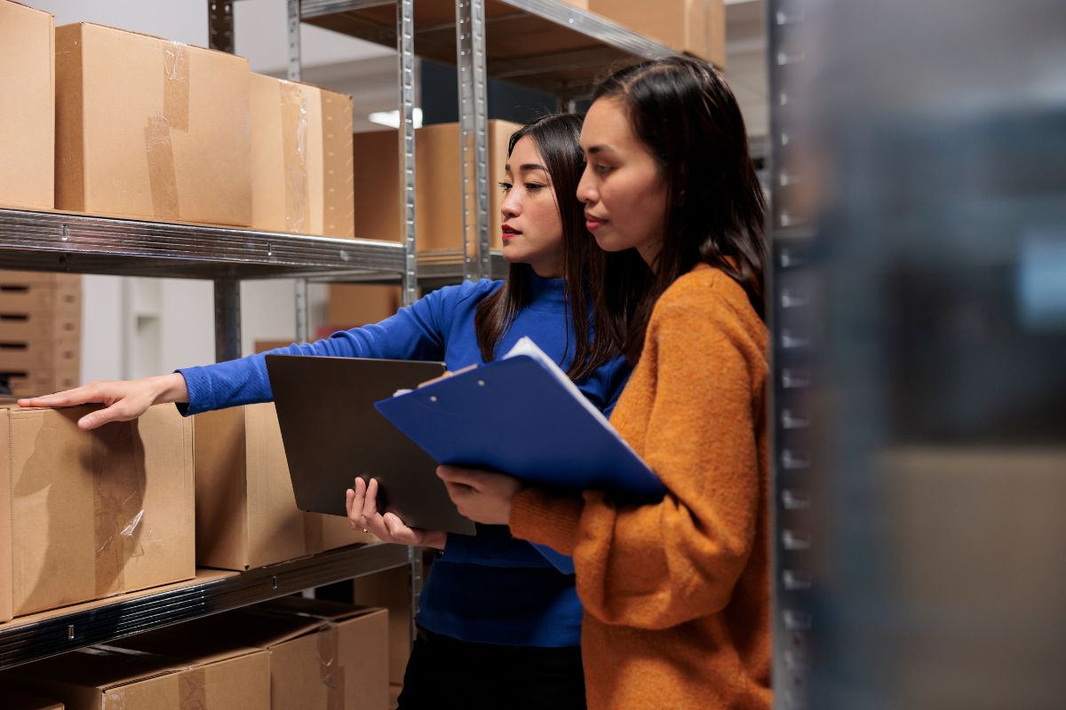 Two Filipino business owners managing their inventory