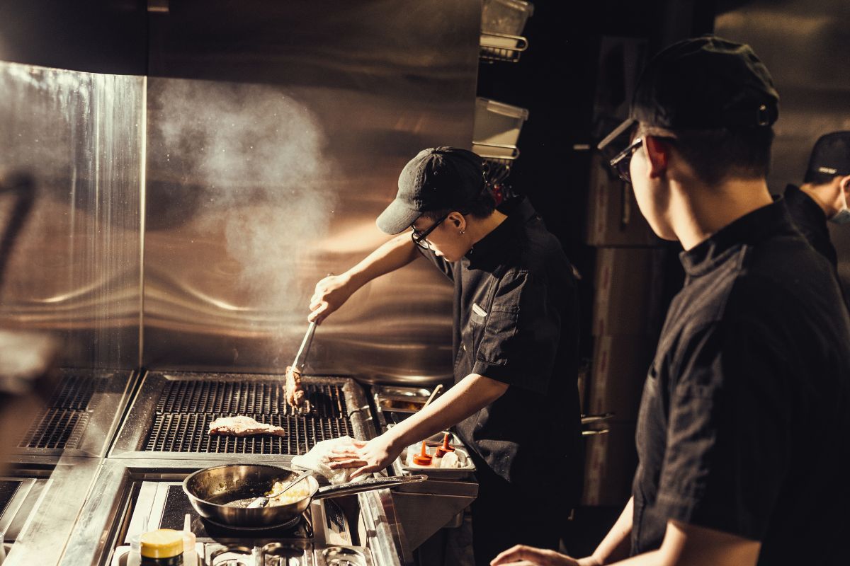 A F&B staff cooking in a restaurant