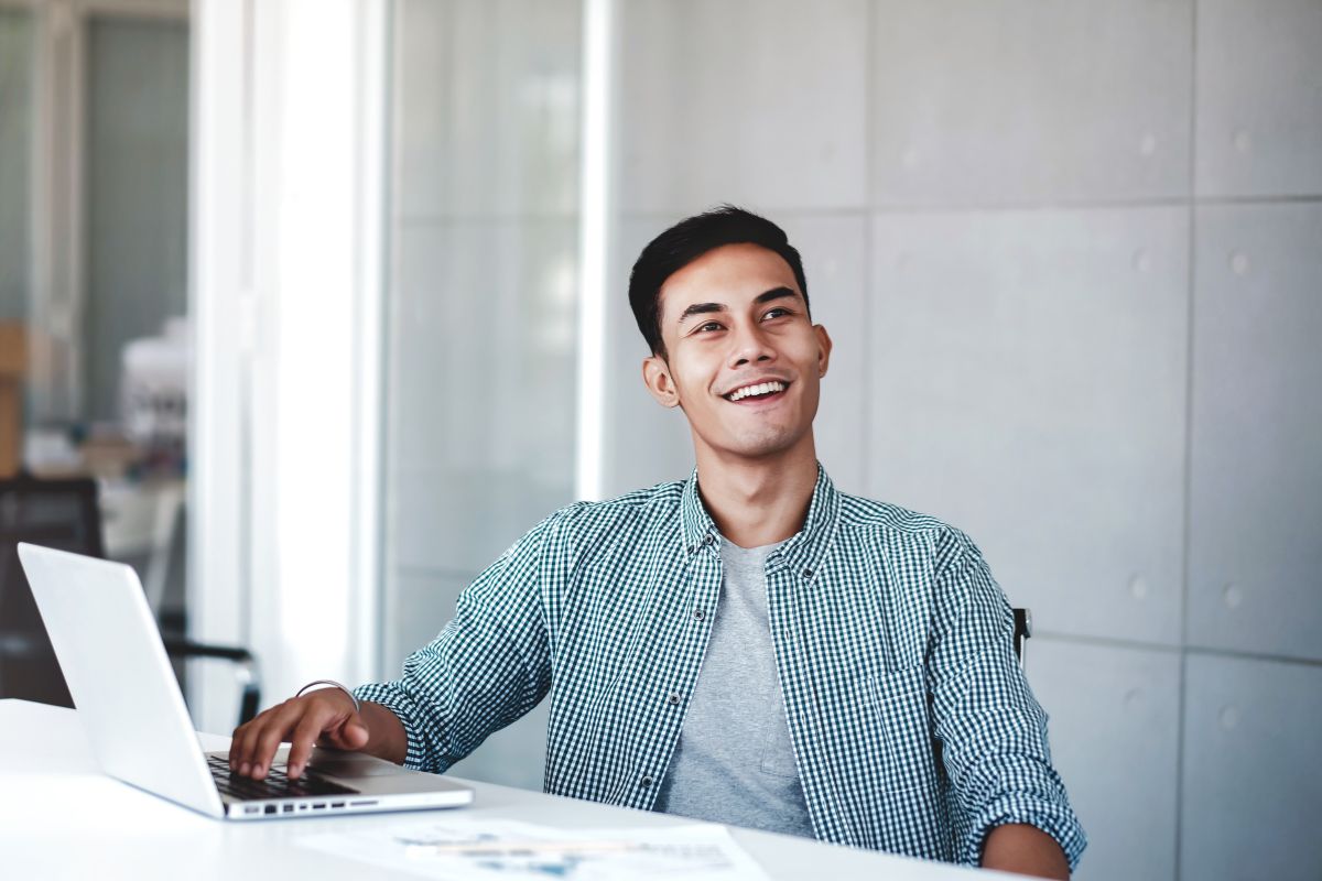 An Overseas Filipino Worker (OFW) on his laptop