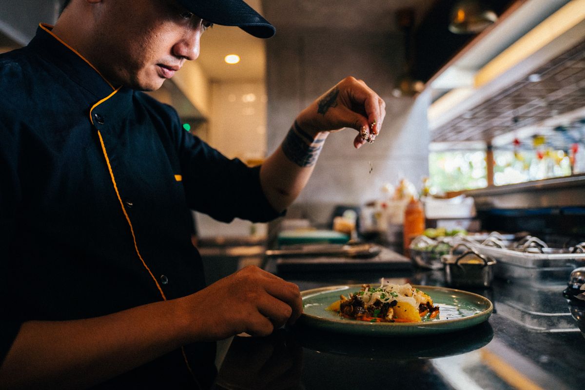 A Filipino F&B staff preparing food