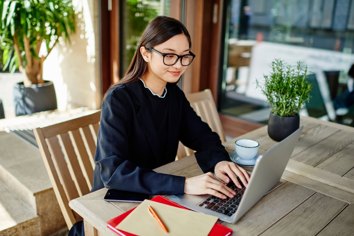A Filipino business owner on her laptop