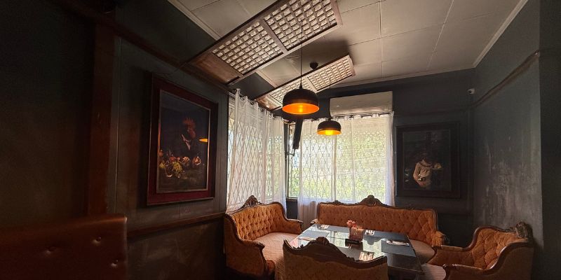 Delgado.112's capiz windows and iconic orange sofa