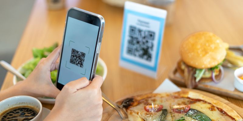 A customer scanning a QR code to order his food
