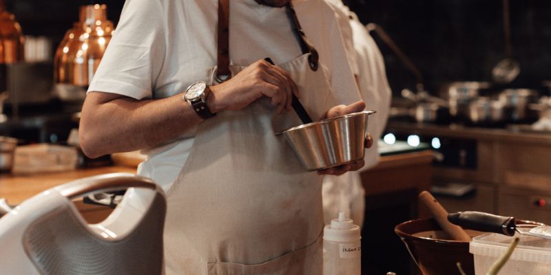 A Filipino business owner cooking