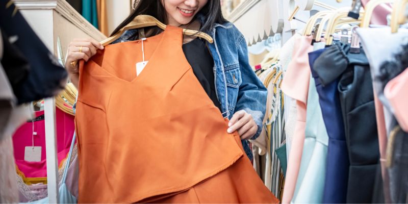 A Filipino retail shopper trying on clothes