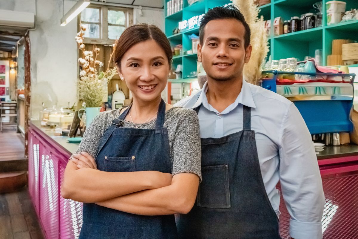 A Filipino couple working together in their restaurant