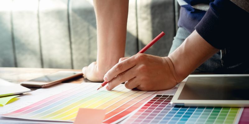 A Filipino business owner choosing her business' color palette