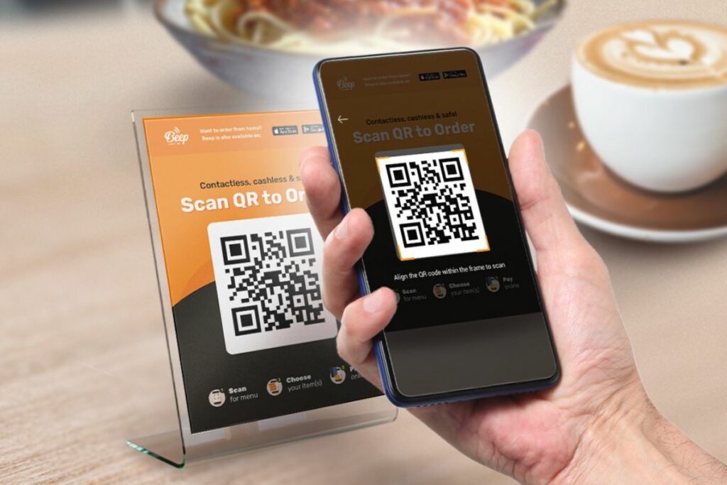 A person scanning a QR Code at a restaurant